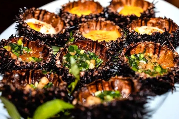 Grilled sea urchin with scallion oil is extremely delicious at Khem Beach