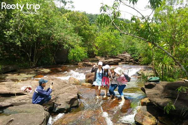 Tourists visiting and taking photos at Suoi Tien Phu Quoc