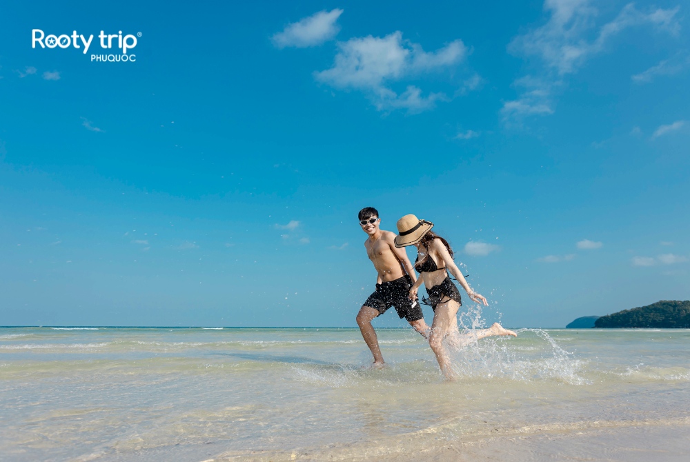 Enjoy beach time at Sao Beach, an essential highlight of our Sunset Town tour - Rooty Trip Phu Quoc