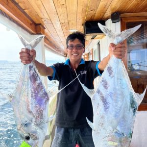 Phu Quoc Offshore Fishing Tour - fisherman holding fresh caught trevally fish on boat